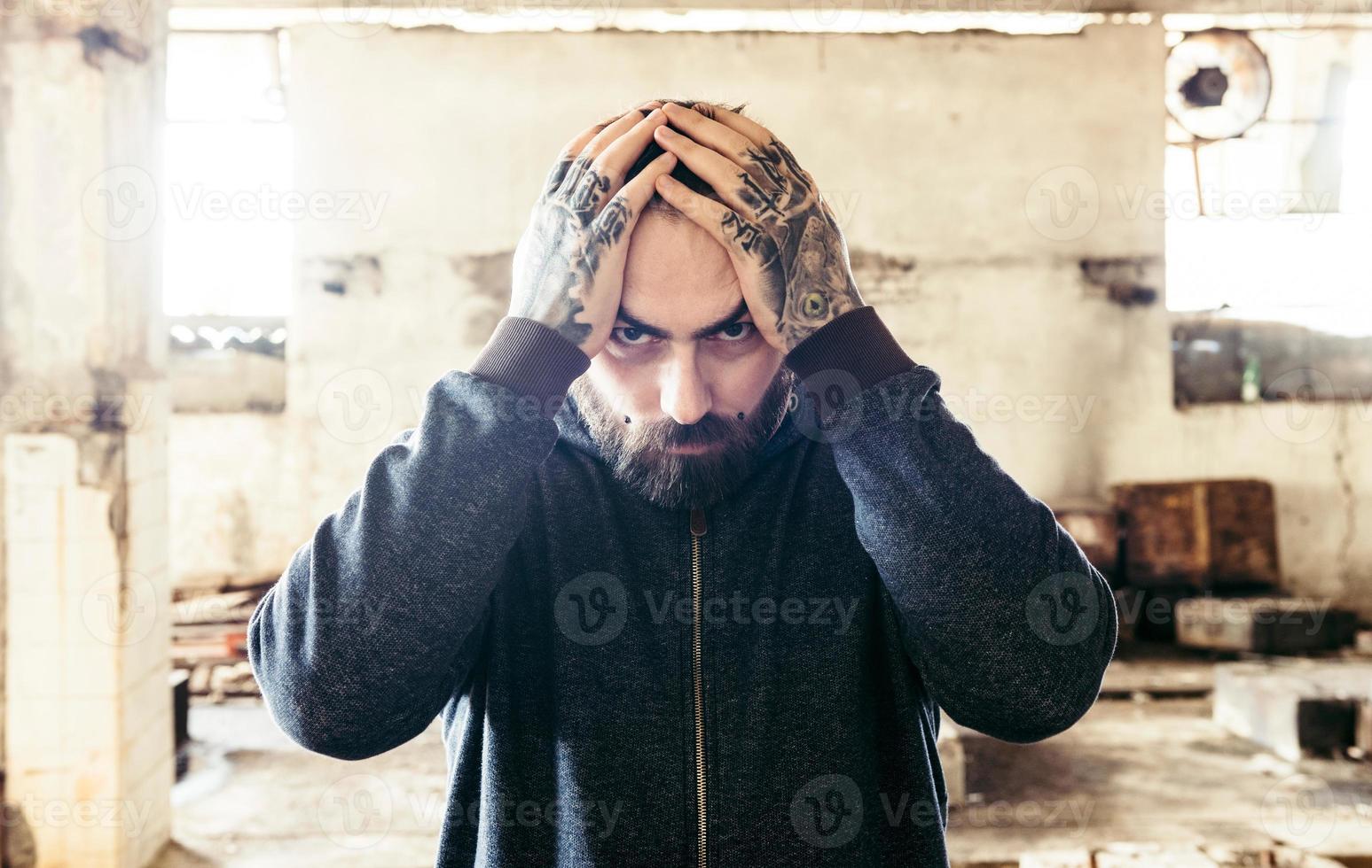 Man with hands on head photo