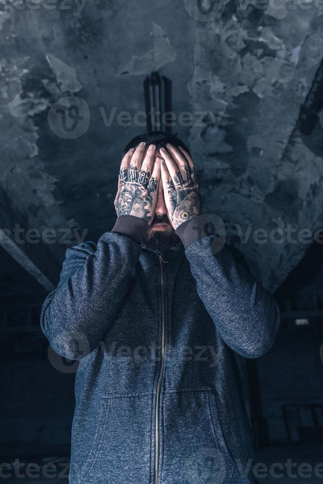 Worried man with hands on head photo