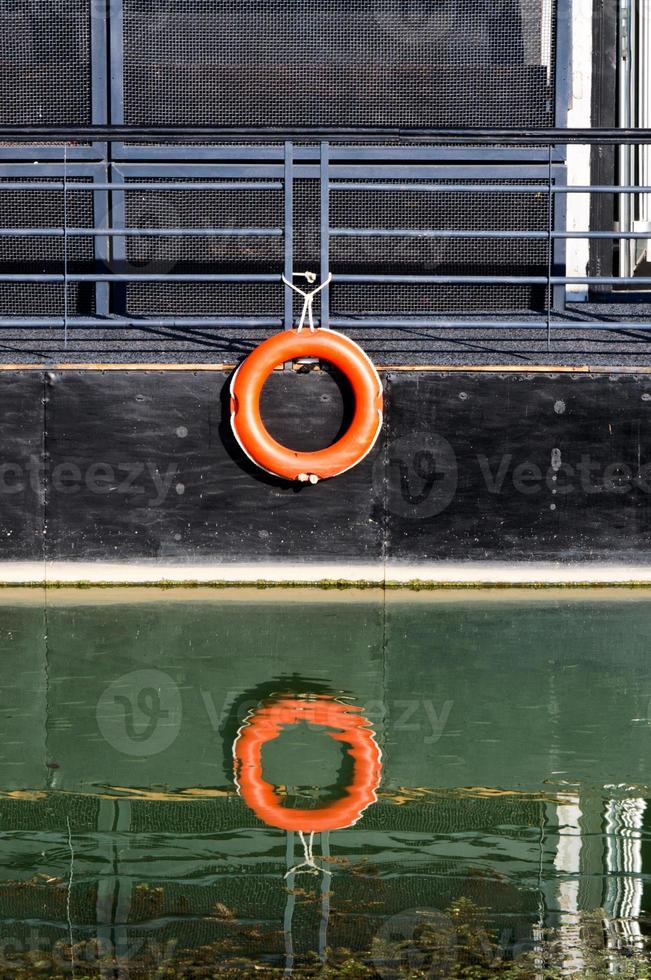 Red buoy on ship photo