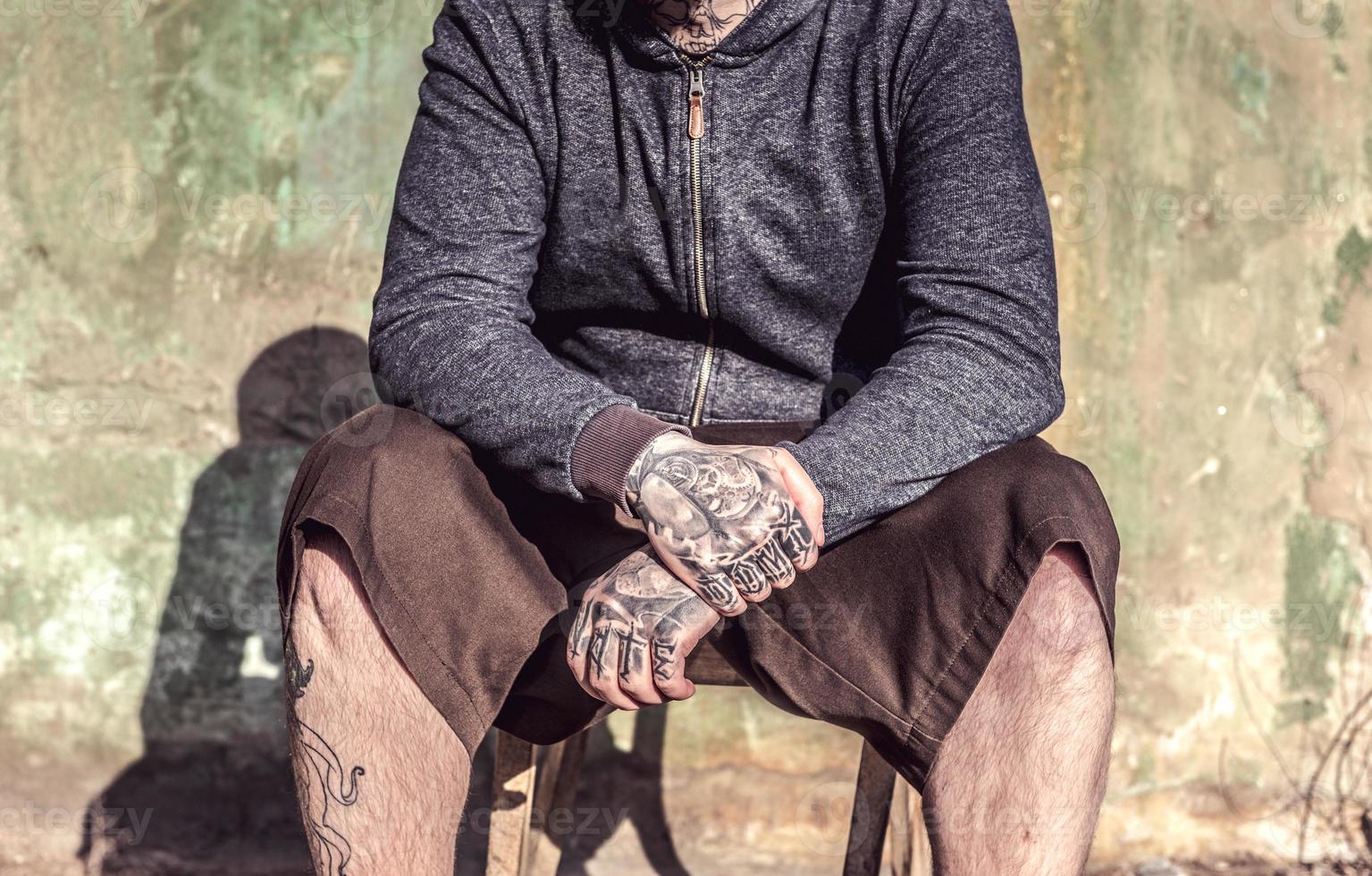 Tattooed mans hands photo