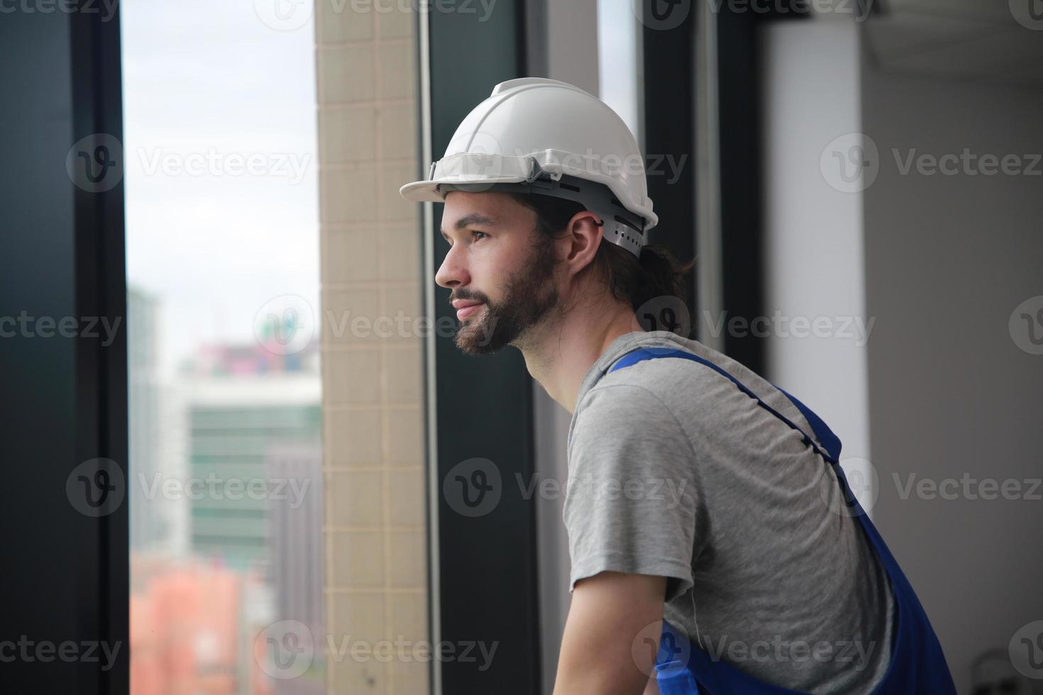 Architect, foreman working at construction or architecture site photo