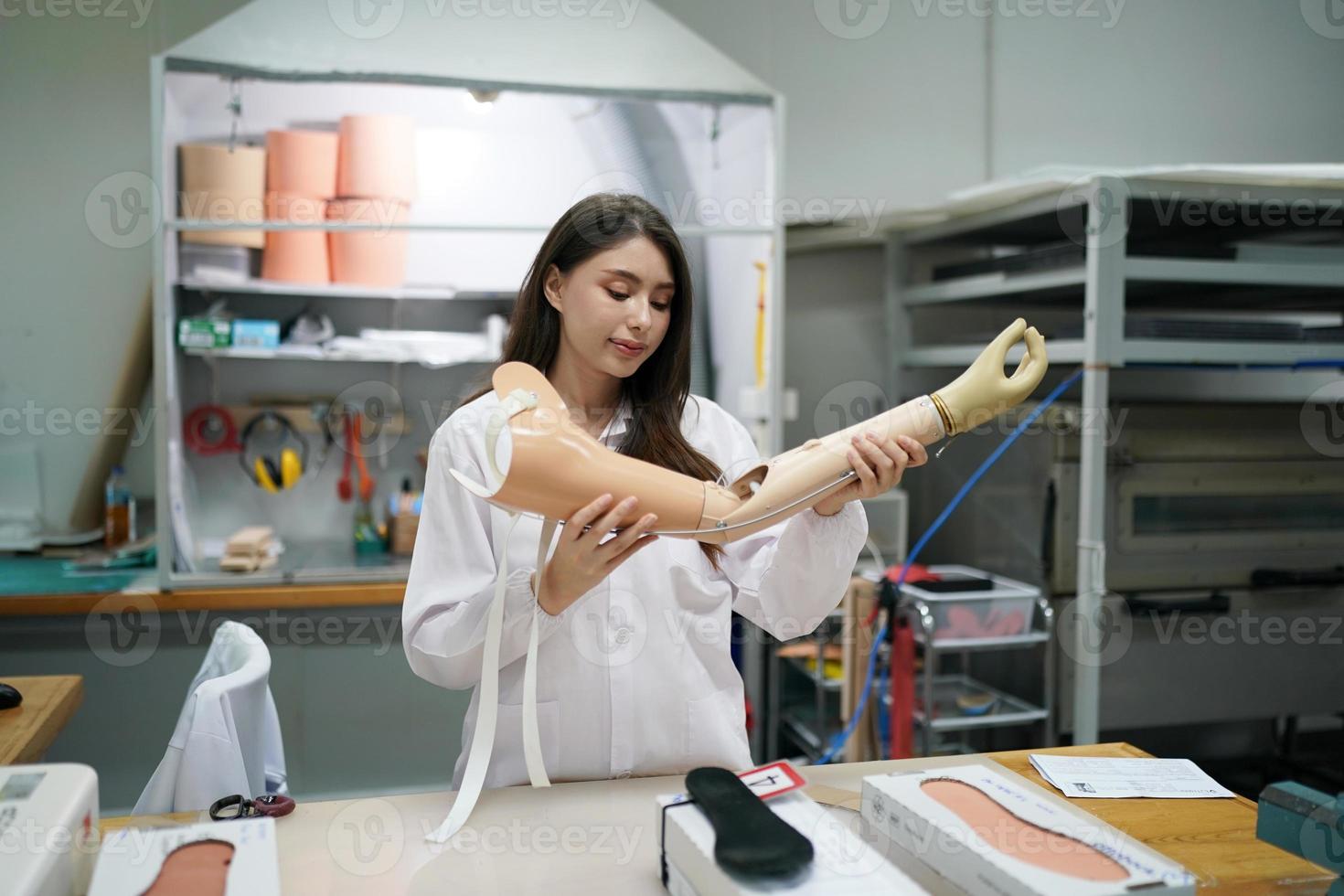 Orthopedic technician making prosthetic leg for disabilities people in