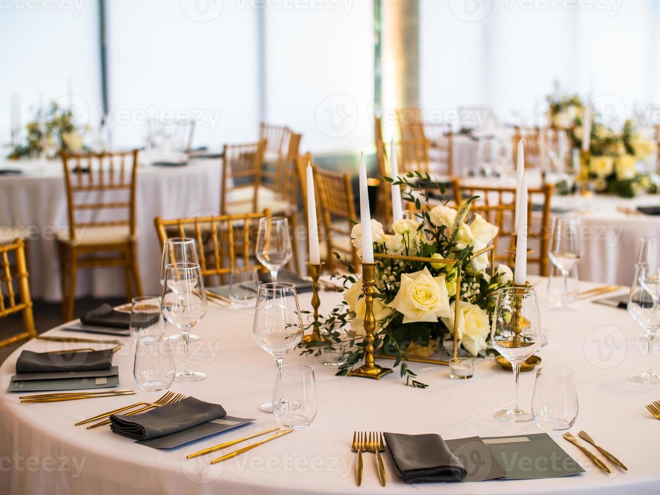 Luxury elegant wedding reception table arrangement and floral centerpiece - wedding banquet and event outdoor photo
