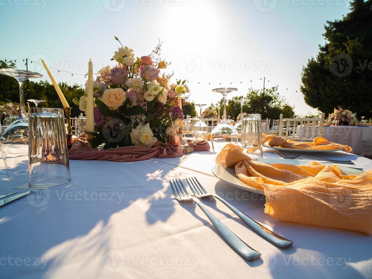 Luxury elegant wedding reception table arrangement and floral centerpiece - wedding banquet and event outdoor photo