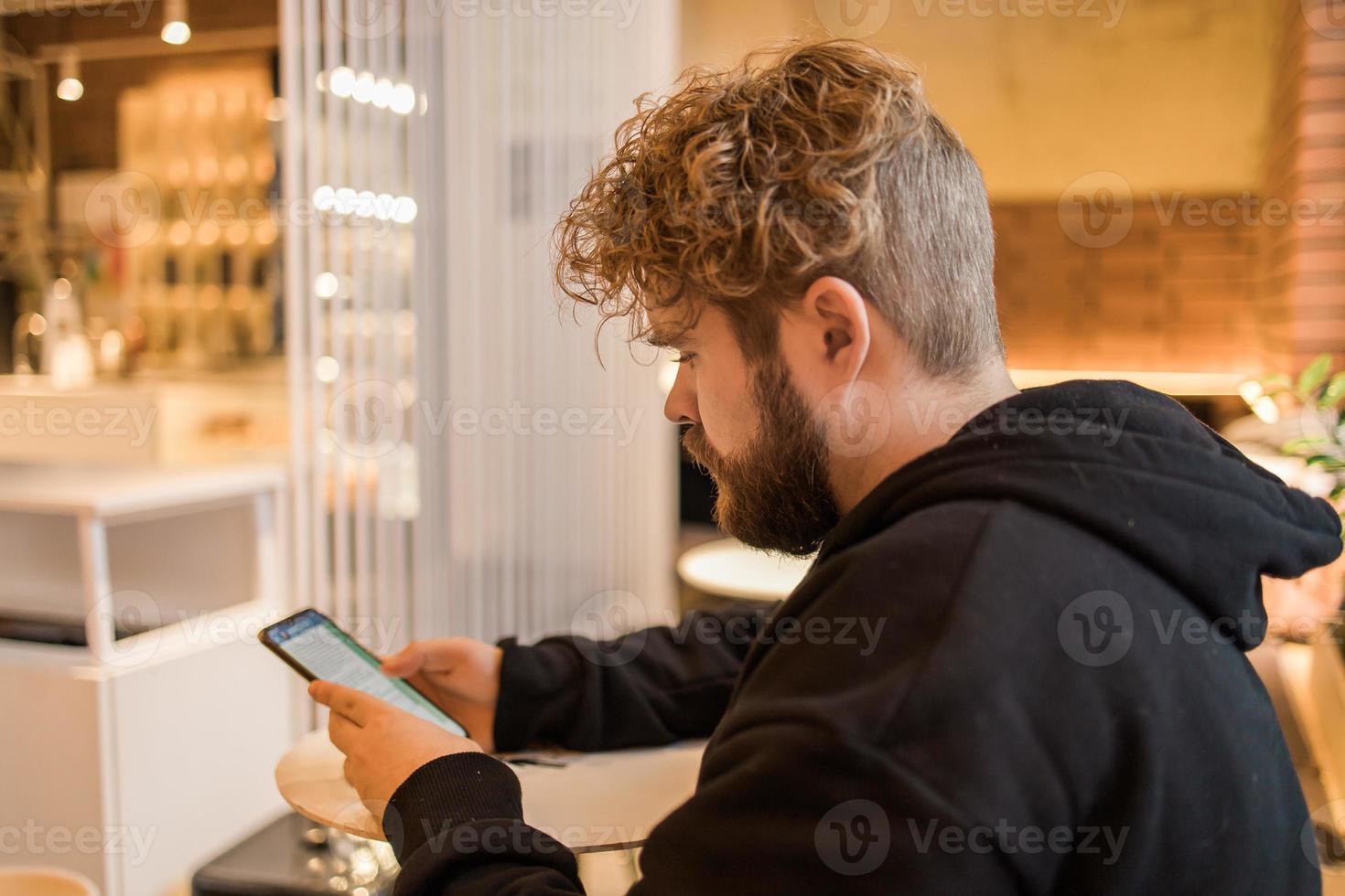 Social media and digital online concept - young man using smart phone with Social media. Living on vacation and playing social media concept photo