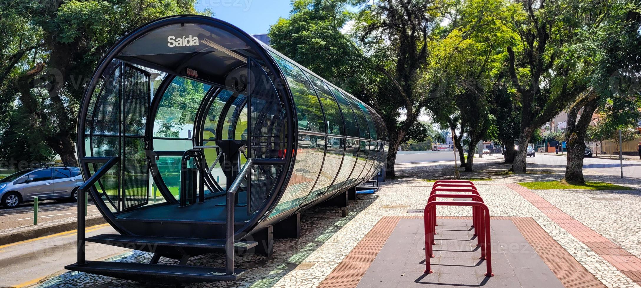 bus stop in the center of curitiba in southern brazil photo