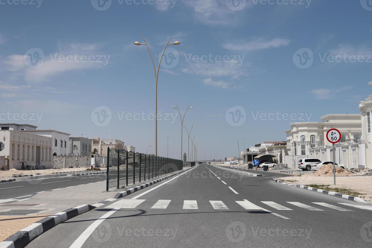 A beautiful view of blue sky and clouds on empty road photo