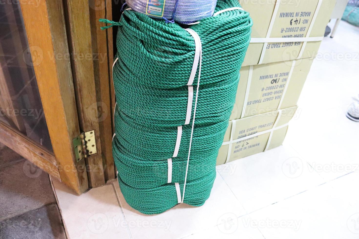 Green colored nylon rope ,twisted green rope in the market outdoor photo