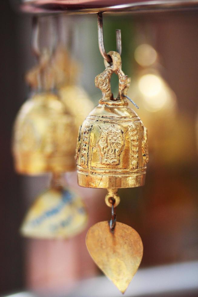 Gold brass Bells Hanging on pagoda in temple, Thailand photo