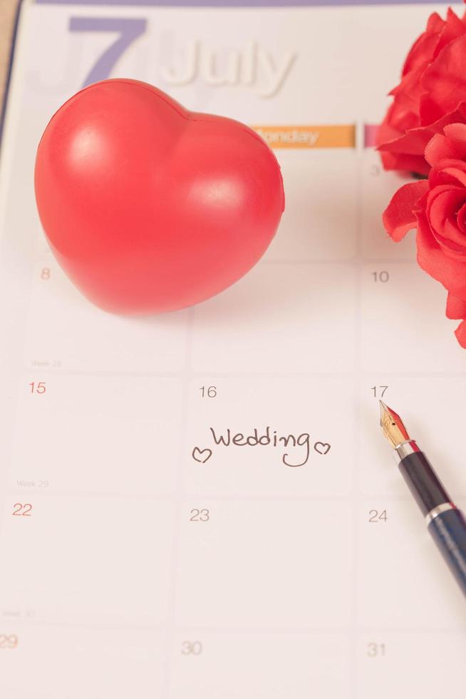 Reminder Wedding day in calendar planning and fountain pen with color tone. photo