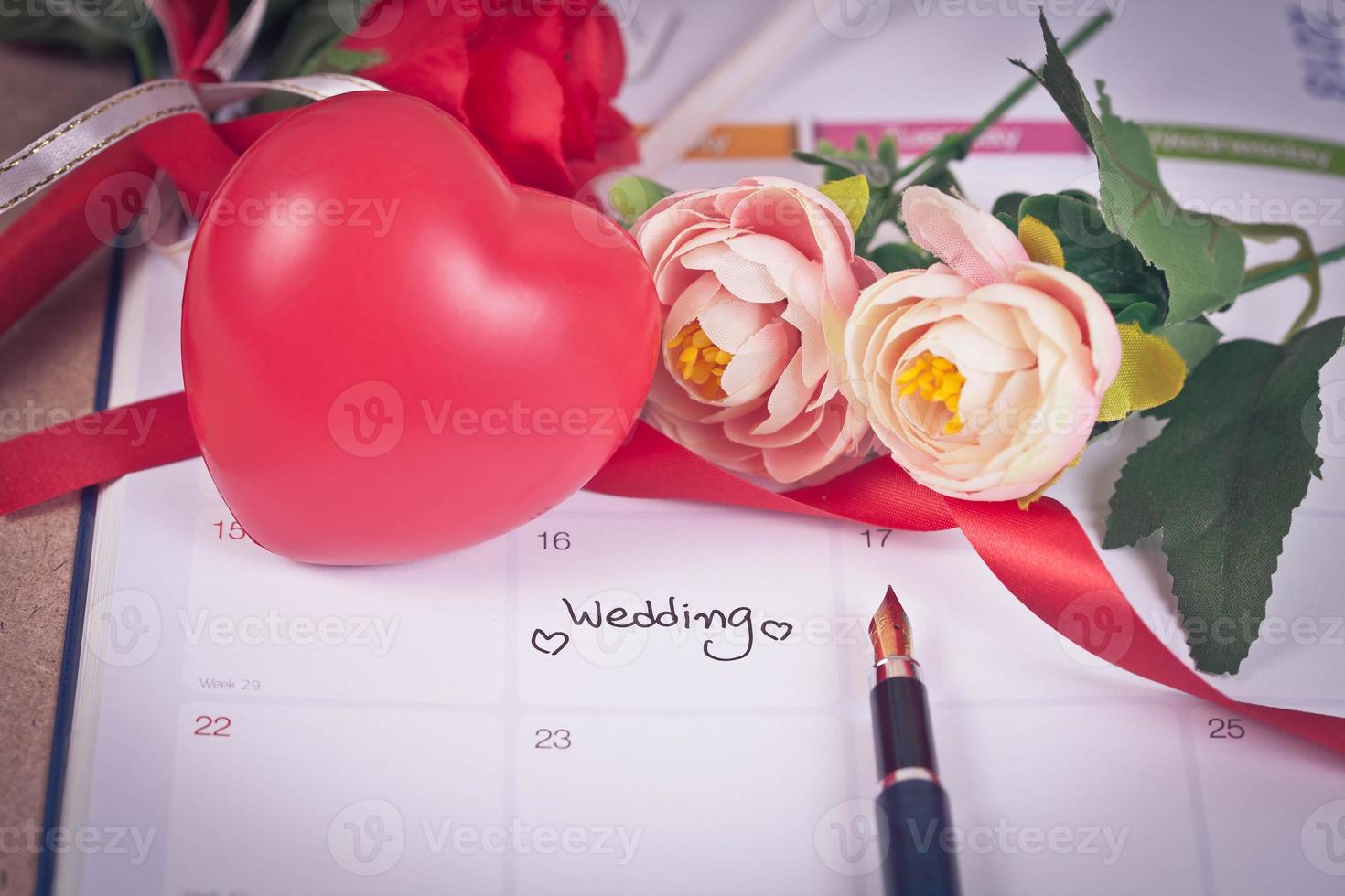 Reminder Wedding day in calendar planning and fountain pen with color tone. photo