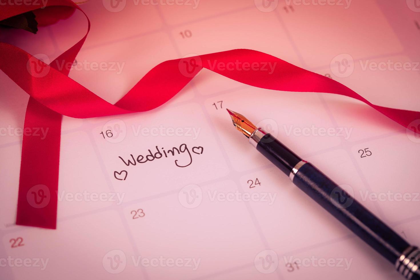 Reminder Wedding day in calendar planning and fountain pen with color tone. photo