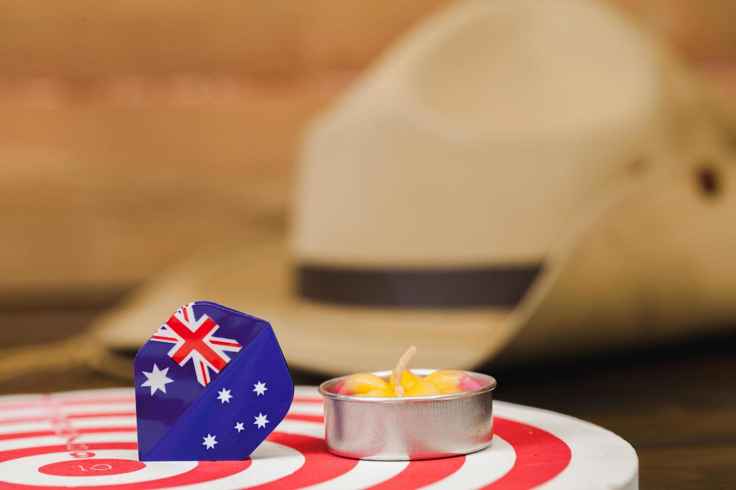 Anzac army slouch hat with Australian Flag on vintage wood background photo