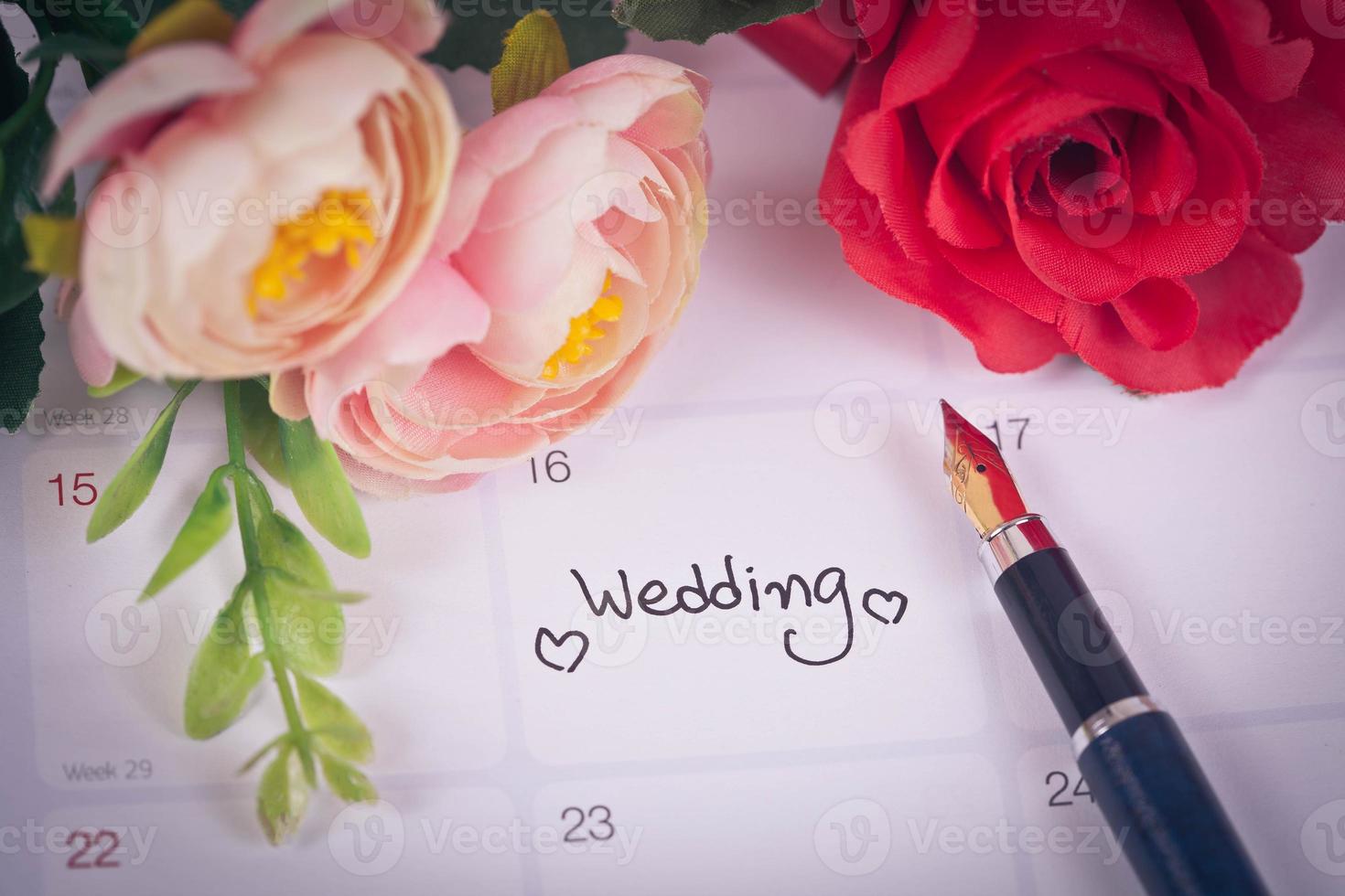 Reminder Wedding day in calendar planning and fountain pen with color tone. photo