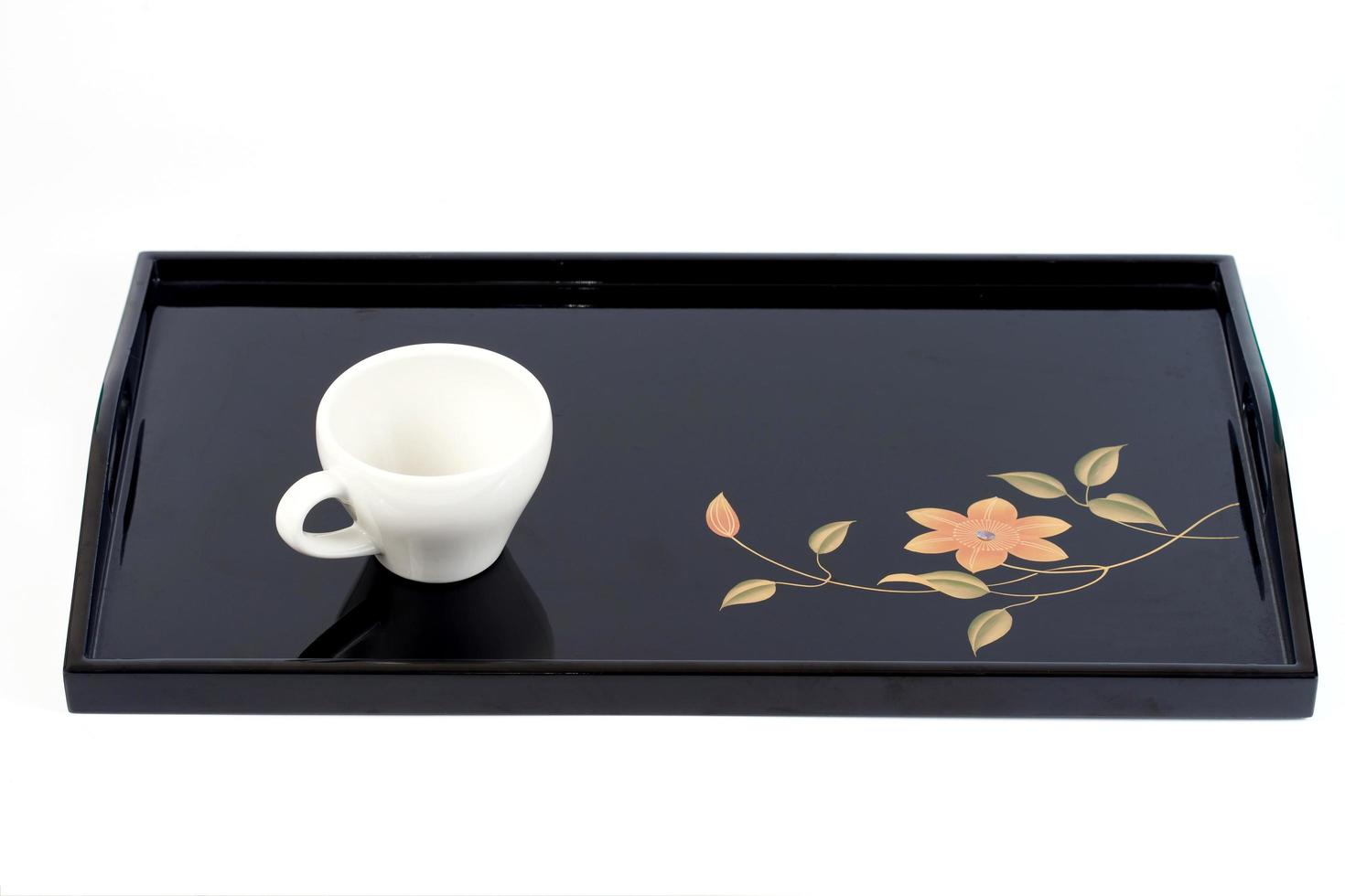 white coffee cup on black food tray photo