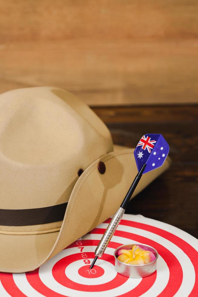 Anzac army slouch hat with Australian Flag on vintage wood background photo