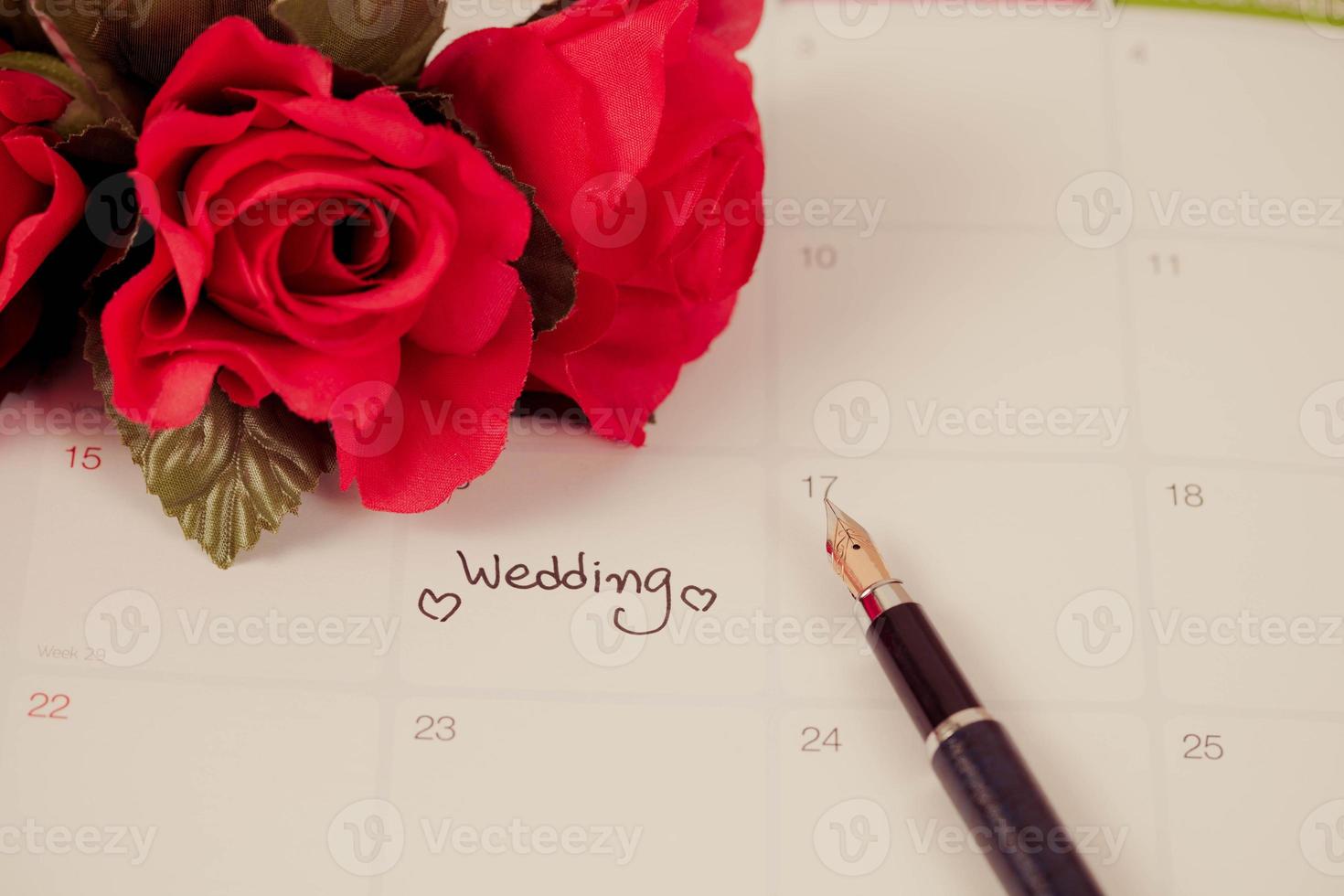 Reminder Wedding day in calendar planning and fountain pen with color tone. photo