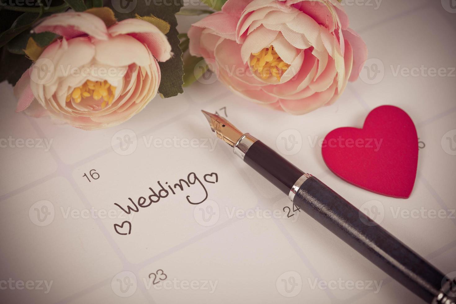 Reminder Wedding day in calendar planning and fountain pen with color tone. photo