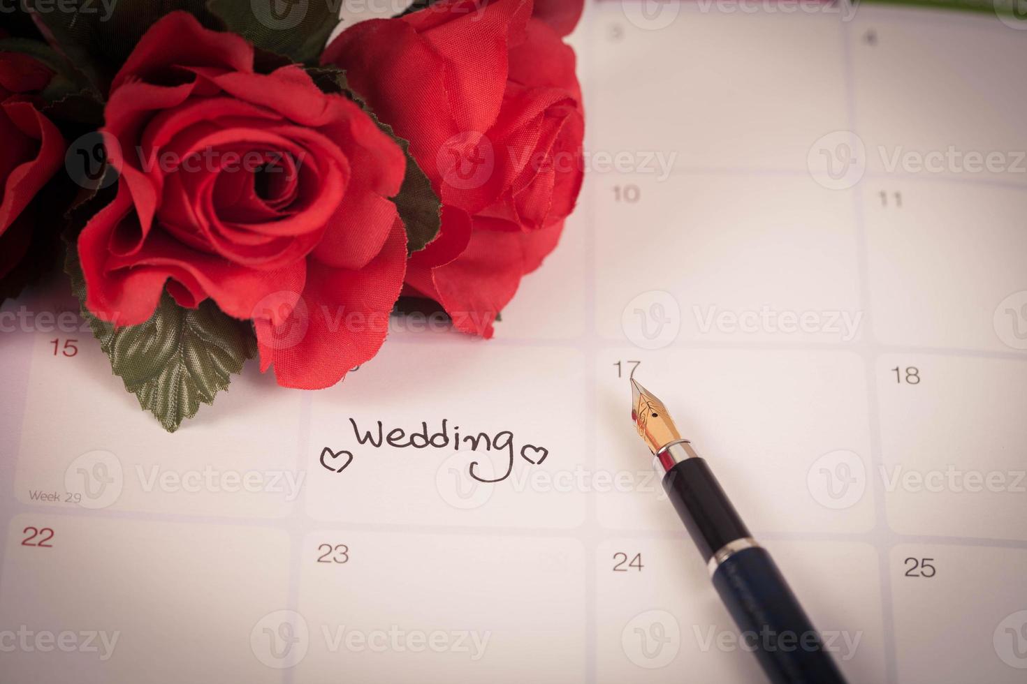 Reminder Wedding day in calendar planning and fountain pen with color tone. photo