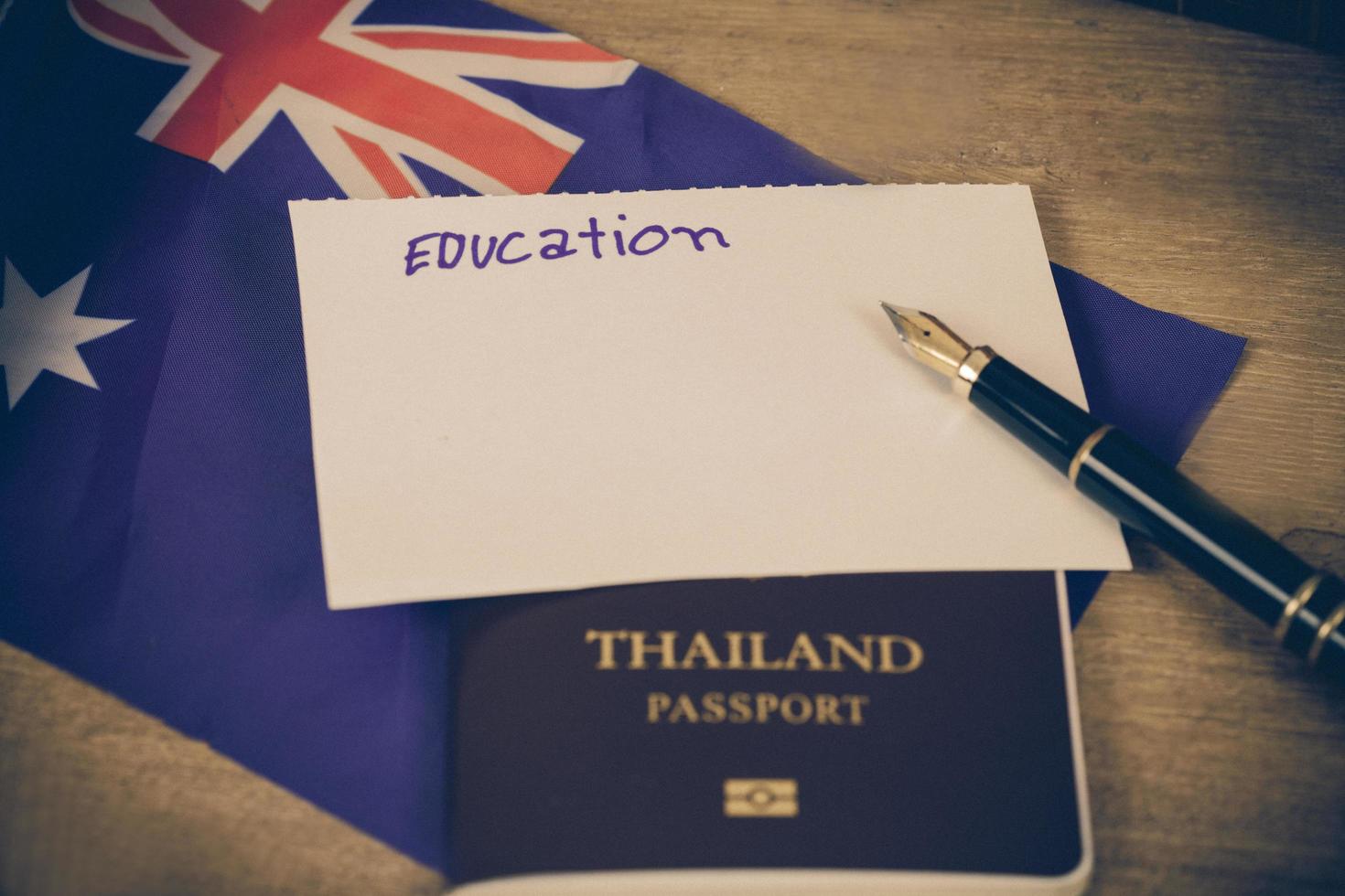 Education in Australia concept,passport and white note on Australia flag . photo