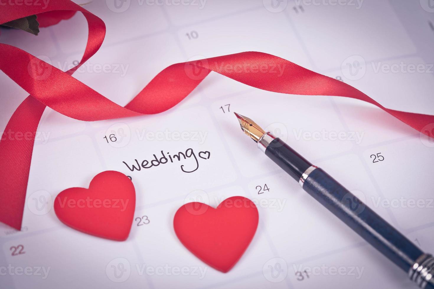 Reminder Wedding day in calendar planning and fountain pen with color tone. photo