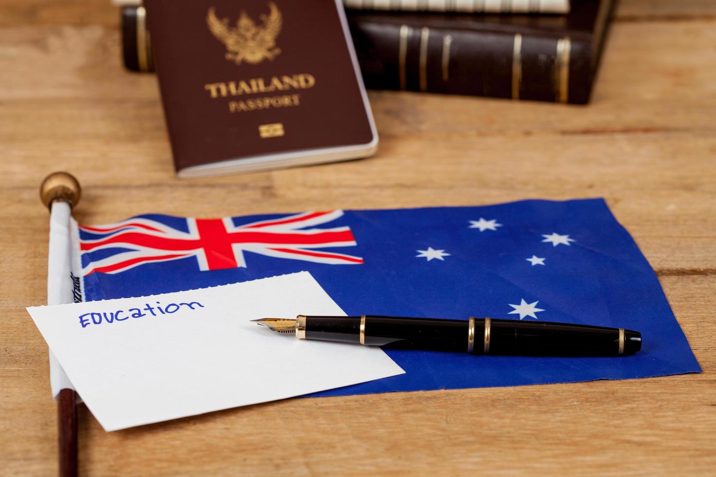 Education in Australia concept,passport and white note on Australia flag . photo