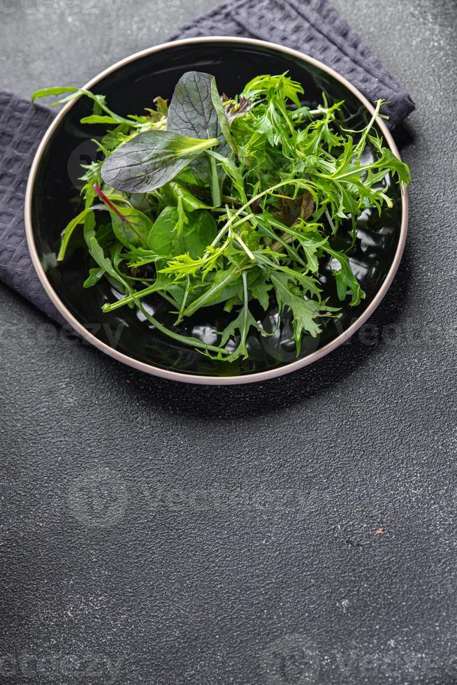 green salad leaves fresh mix healthy snack food on the table copy space food background rustic top view photo