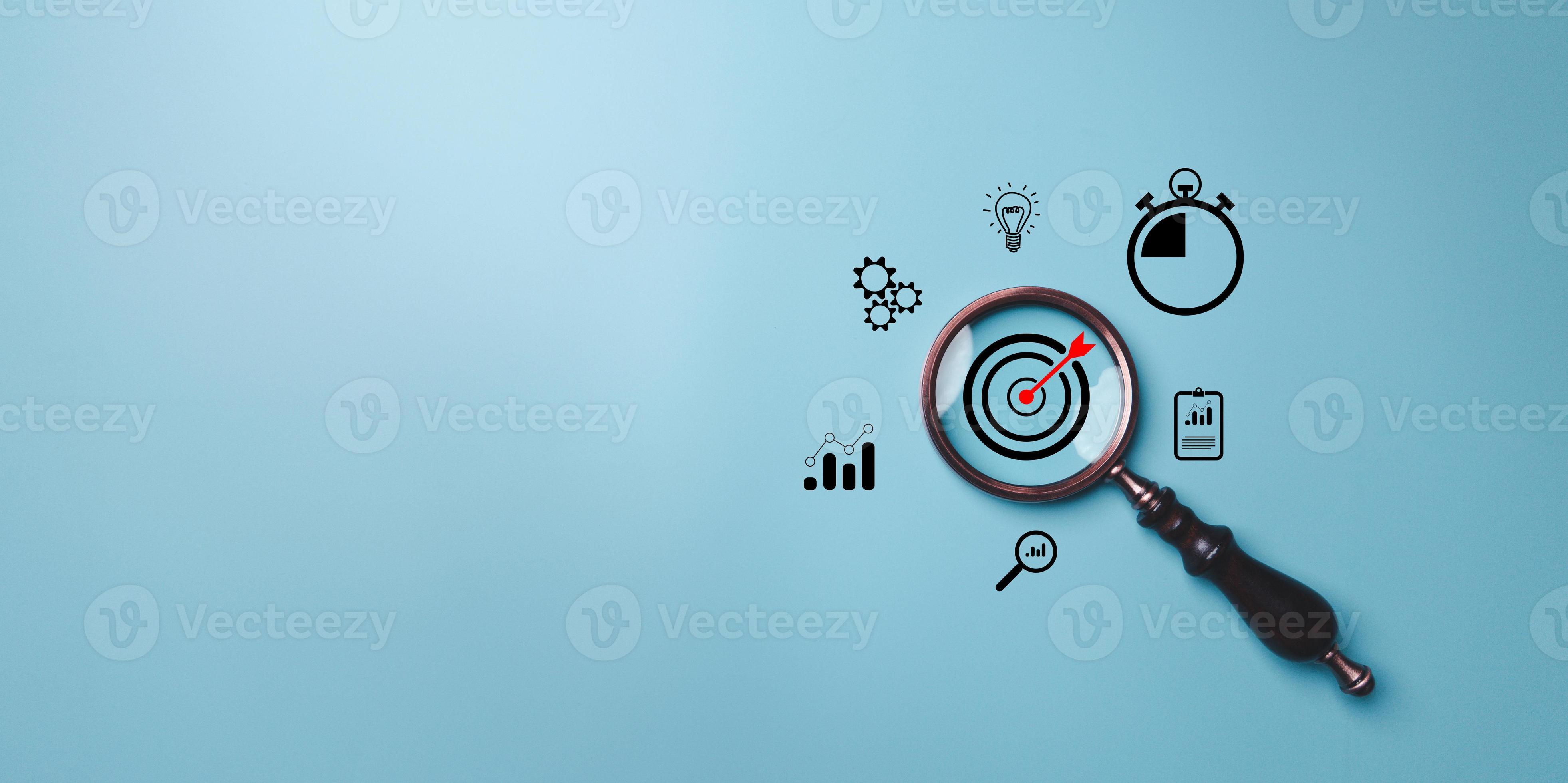Target board inside vintage magnifying glass for focus business