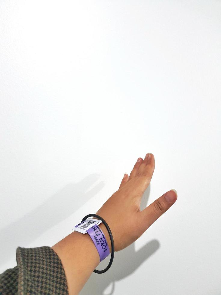 Jakarta, Indonesia on March 2023. Isolated photo of a hand with wristband blackpink concert