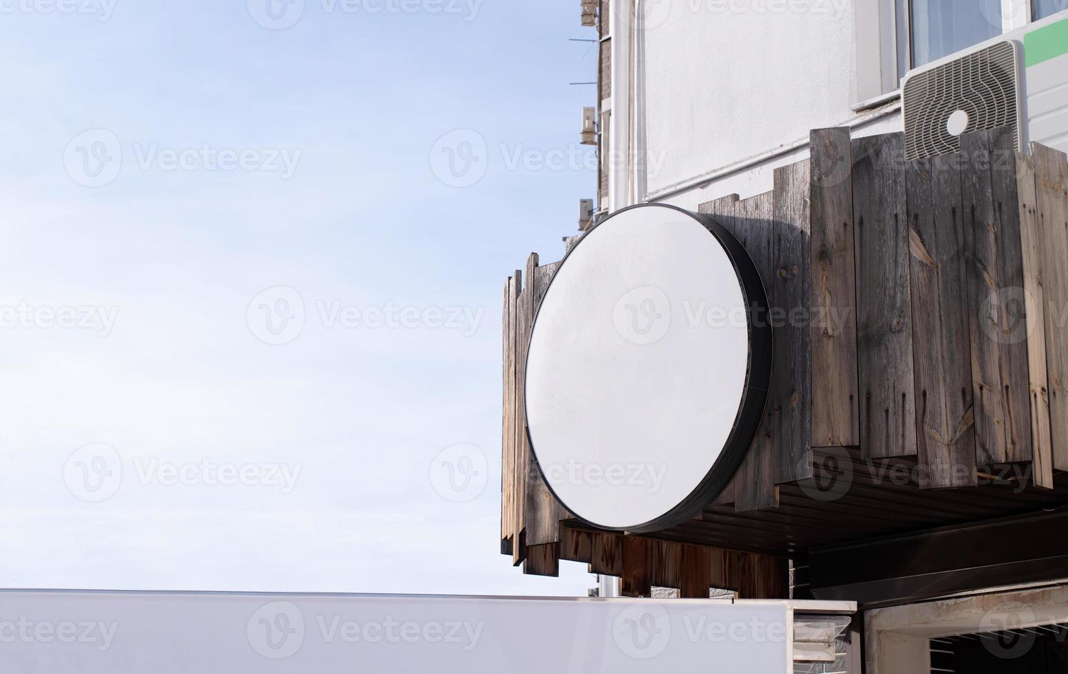 white round logo on building wall , exterior for mockup design photo