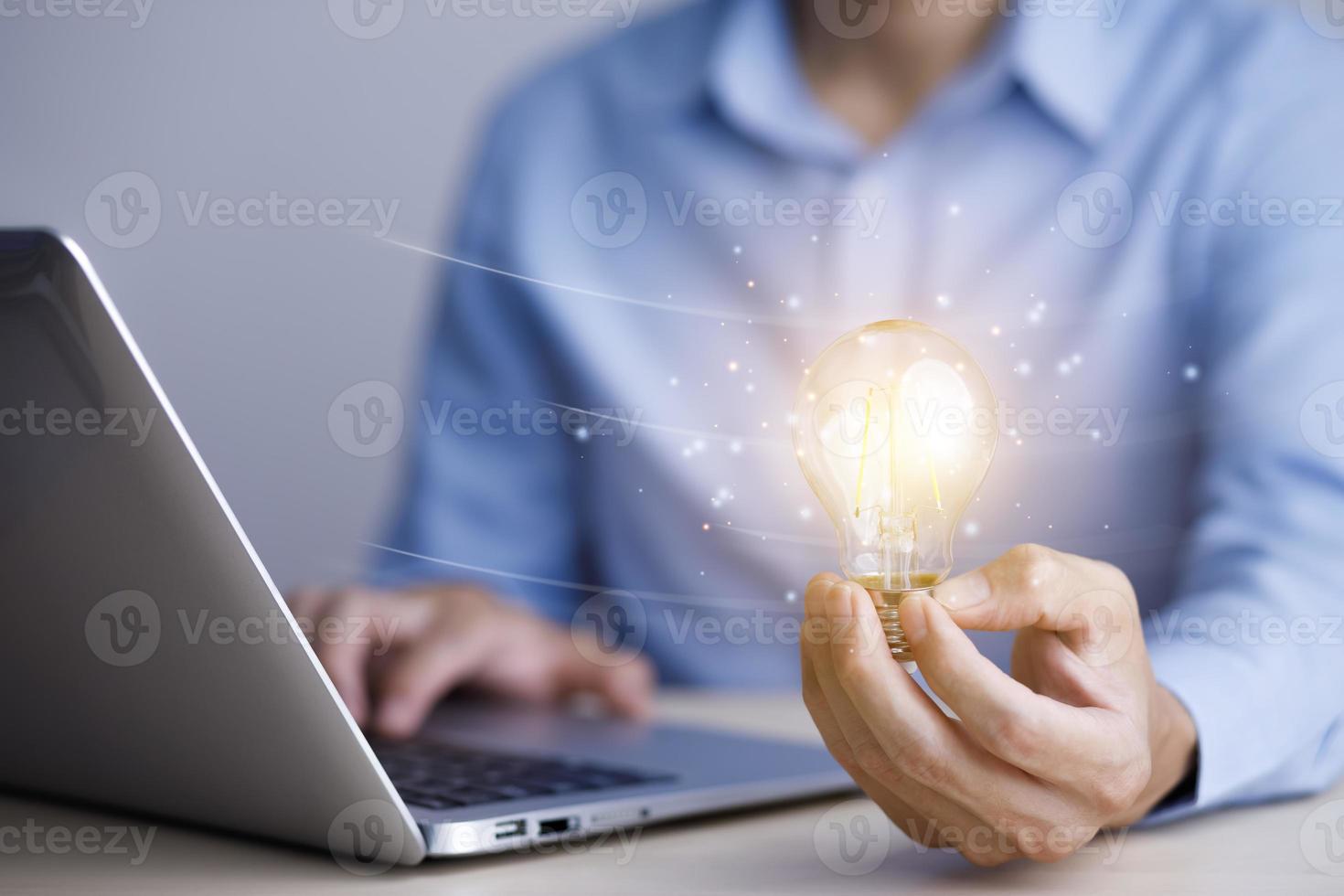 thinking and creative concept, Close up the light bulb and man working on the desk, Creativity, and innovation are keys to success,  new idea and innovation with Brain and light bulbs,big data photo