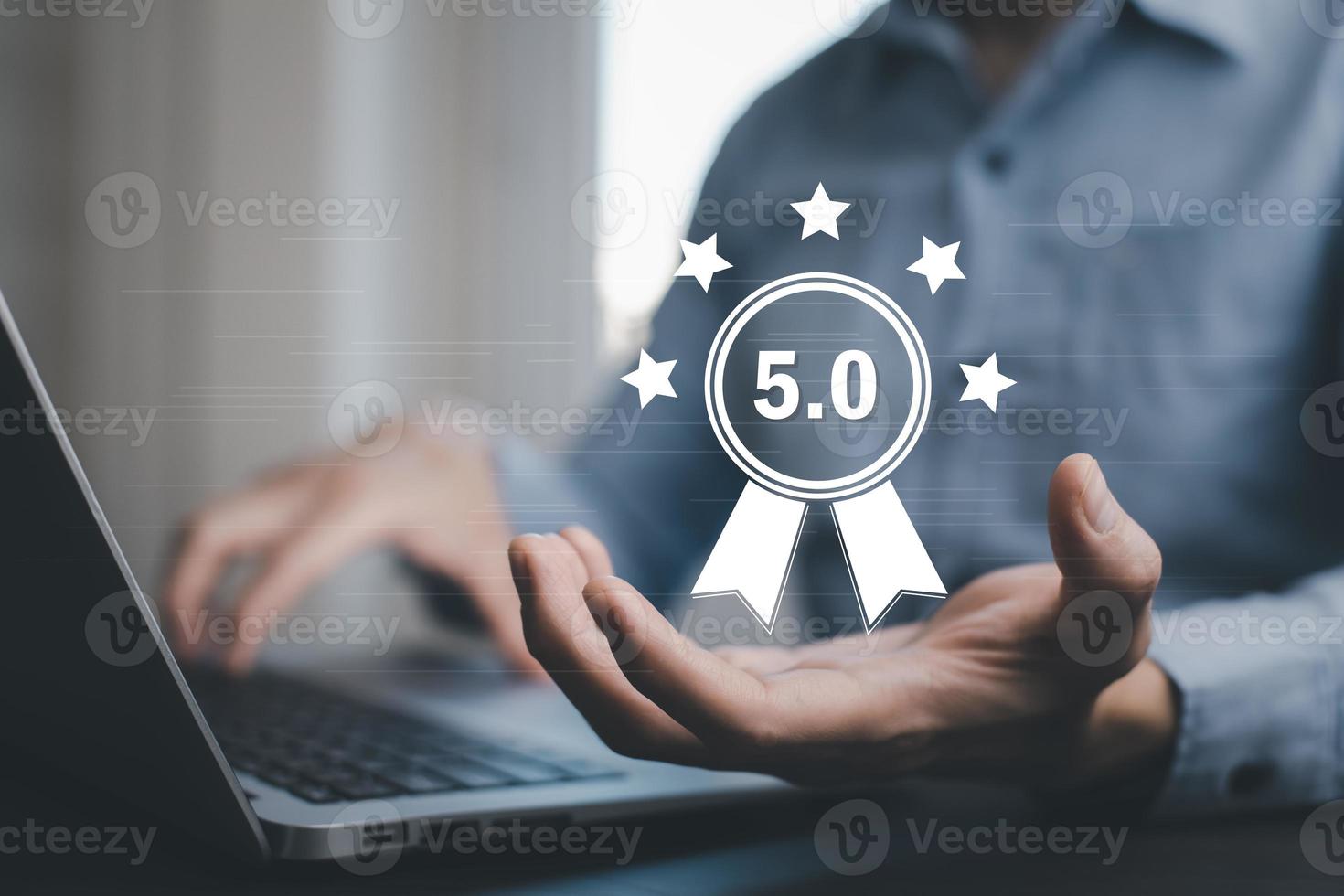 Man using laptop with Customer review satisfaction feedback survey concept, Customer review with feedback survey ,The concept of consumer reviews with review people icon with smartphone reviews. photo