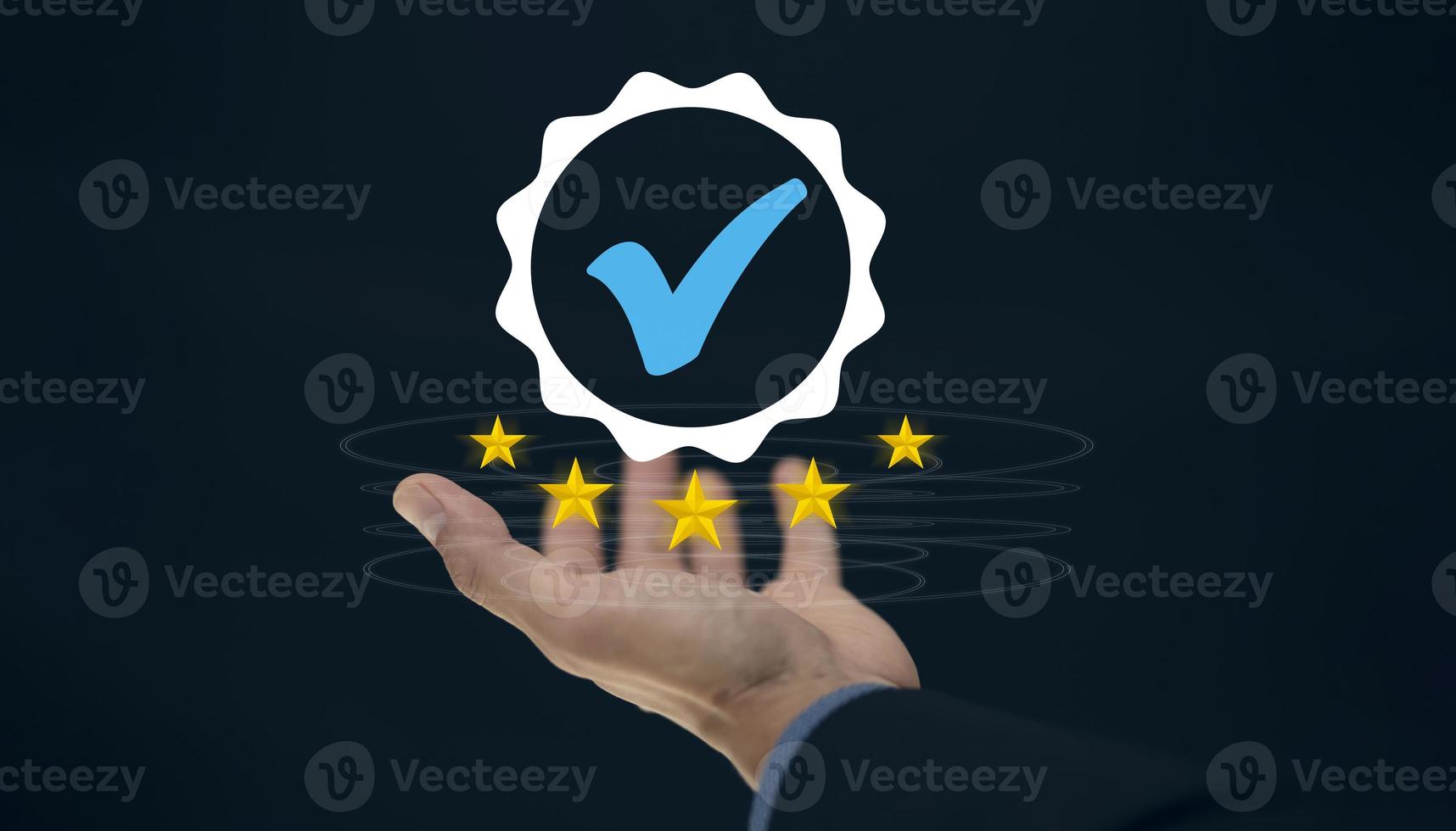 Quality assurance of business services, Businessman Hand shows the sign of the top service Quality assurance in Black background , Guarantee, Standards, ISO certification and standardization concept. photo