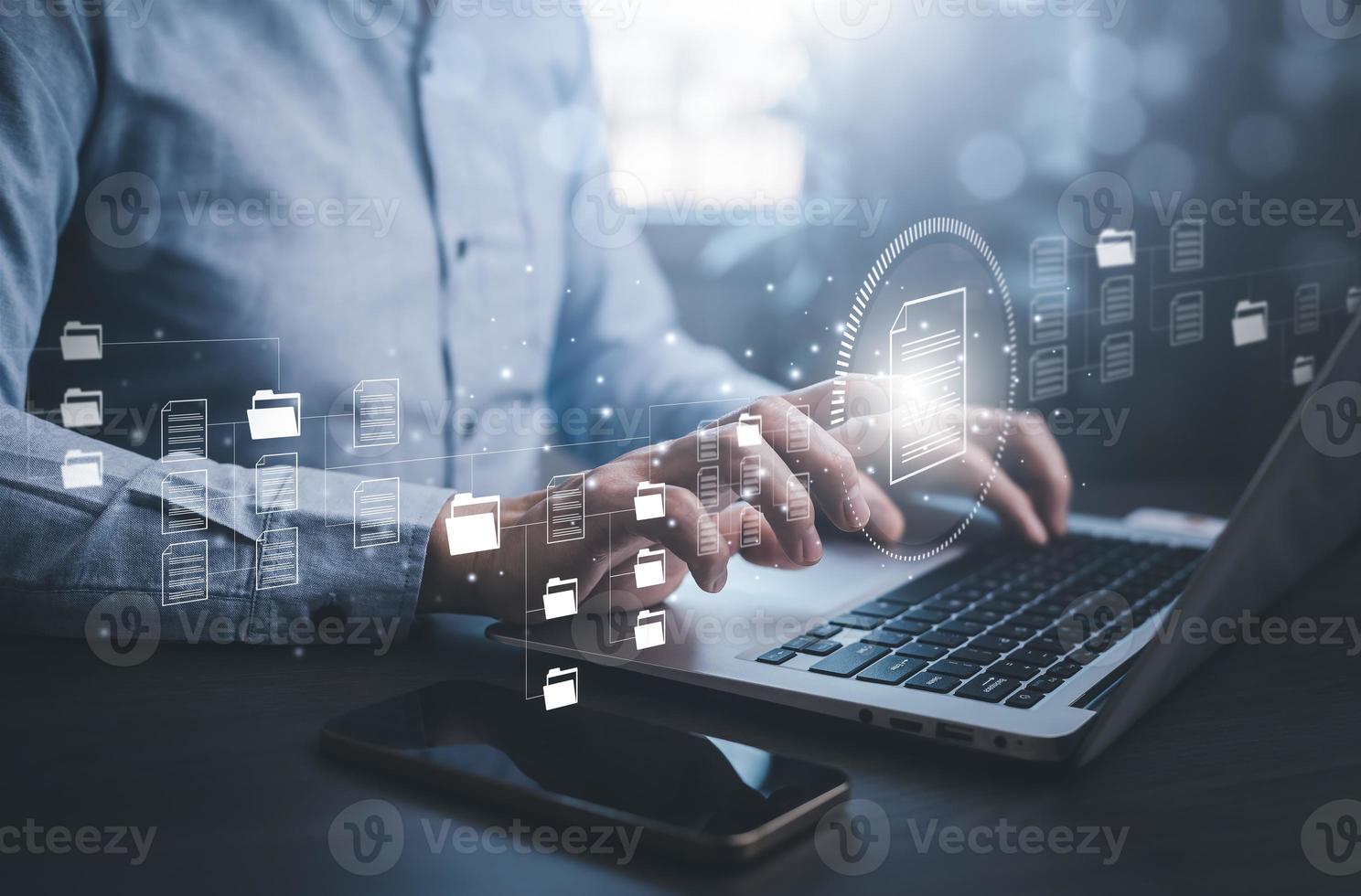 E-signing, electronic signature, document management concept, Man working on laptops with Online documentation database, searching and managing corporate files, documentation in enterprise with ERP. photo