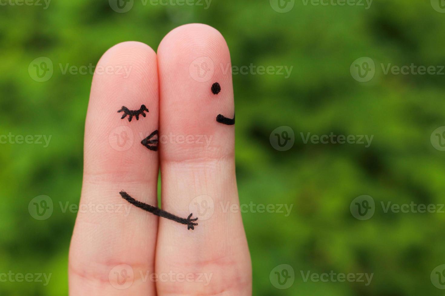 Finger art of a Happy couple. Girl a hug and kisses the boy. photo