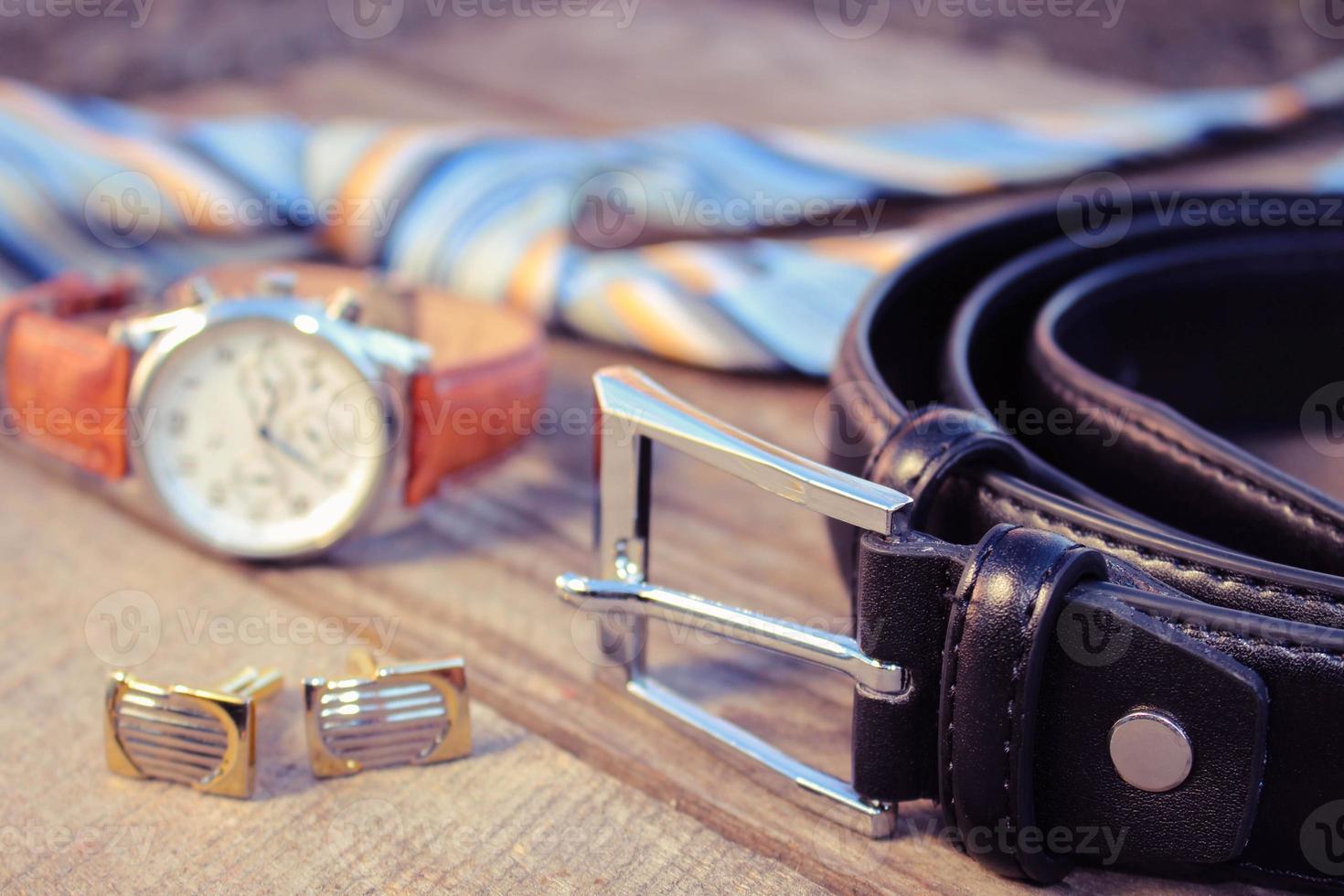 Leather belt, tie, cufflinks and watches photo