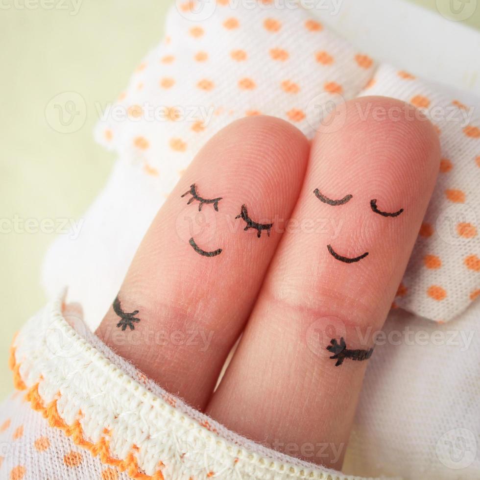 Finger art of a Happy couple. Couple asleep in bed. photo