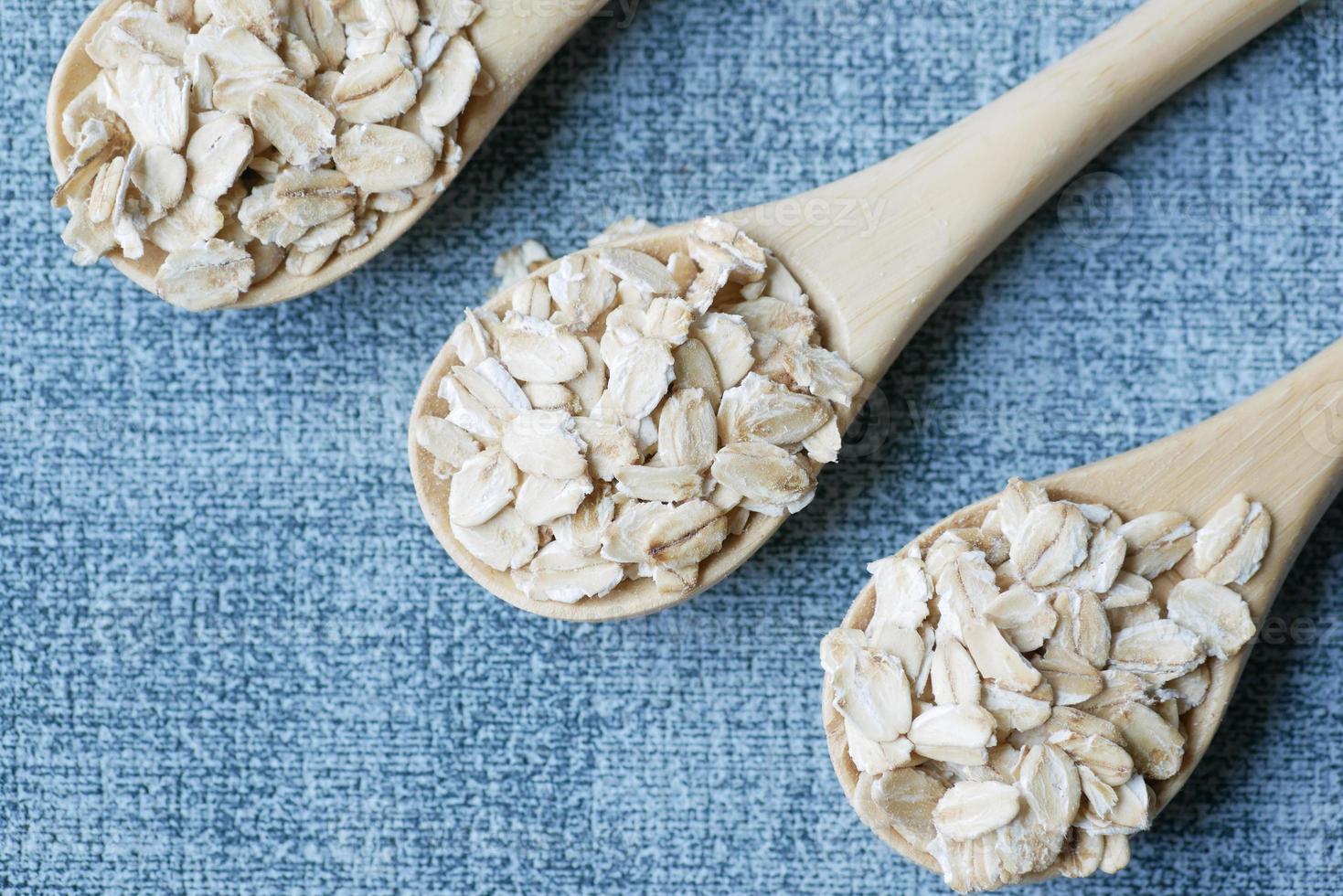 roasted oats flakes spilling on table photo