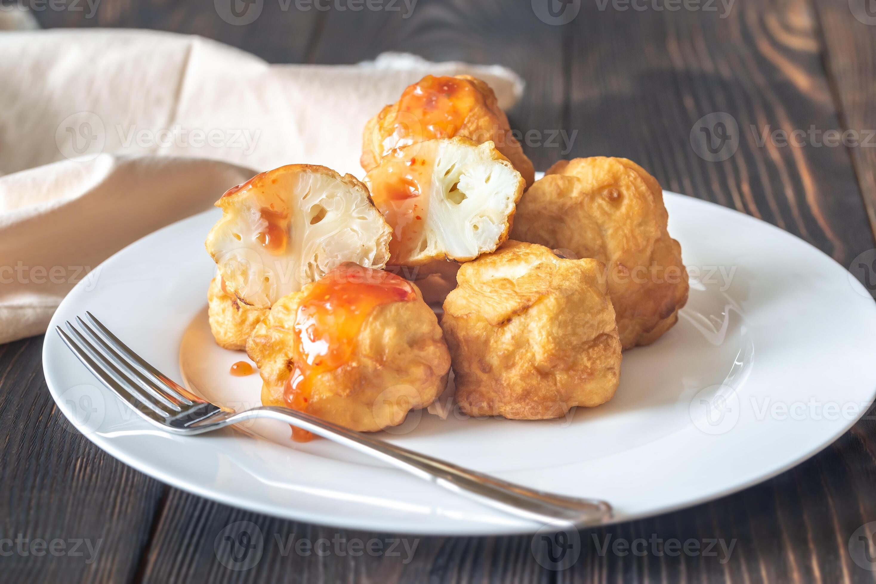 Fried cauliflower coated in batter 23057033 Stock Photo at Vecteezy