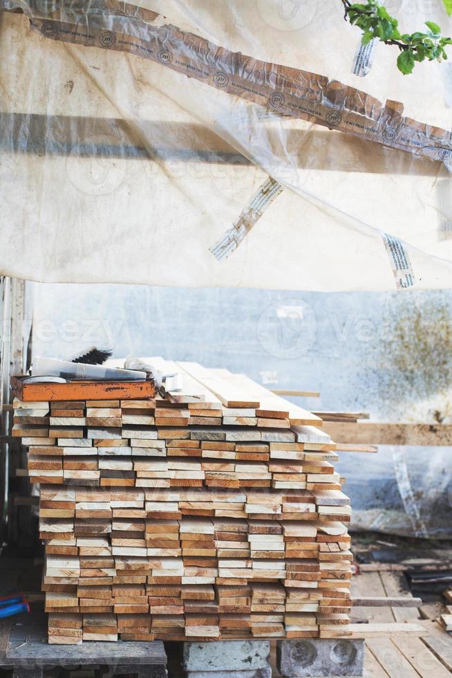 the boards are stacked in the garden photo