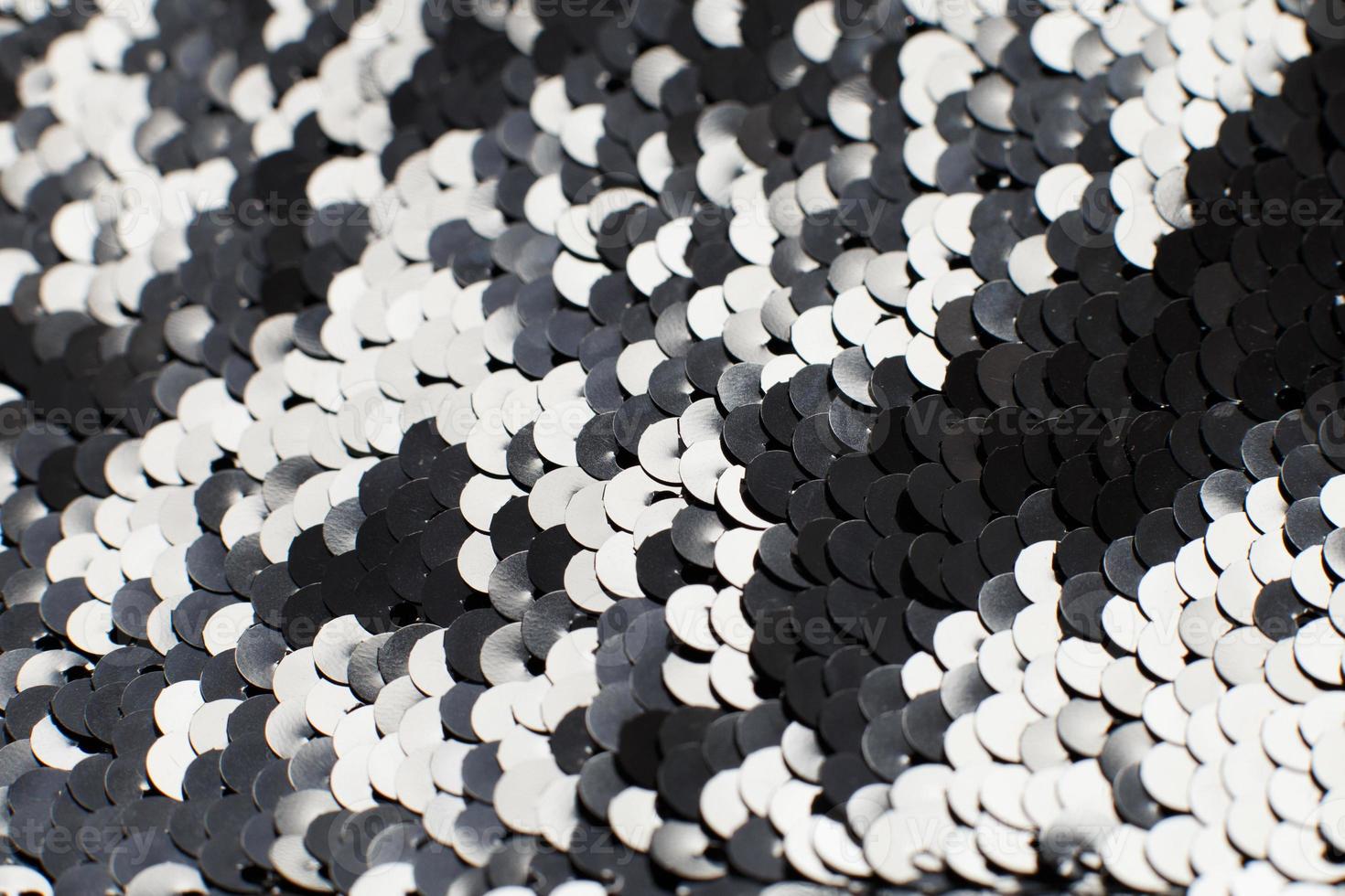 background of silver sequins. shiny sparkling background photo