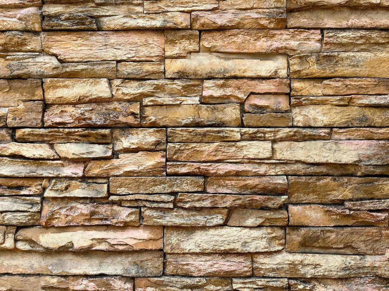 Wall made of decorative stones background texture photo