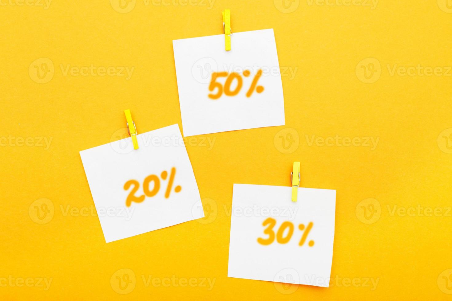 discount paper stickers on an orange background photo