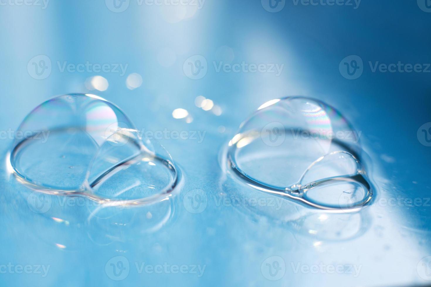 soap bubble close up. abstract blue water background photo