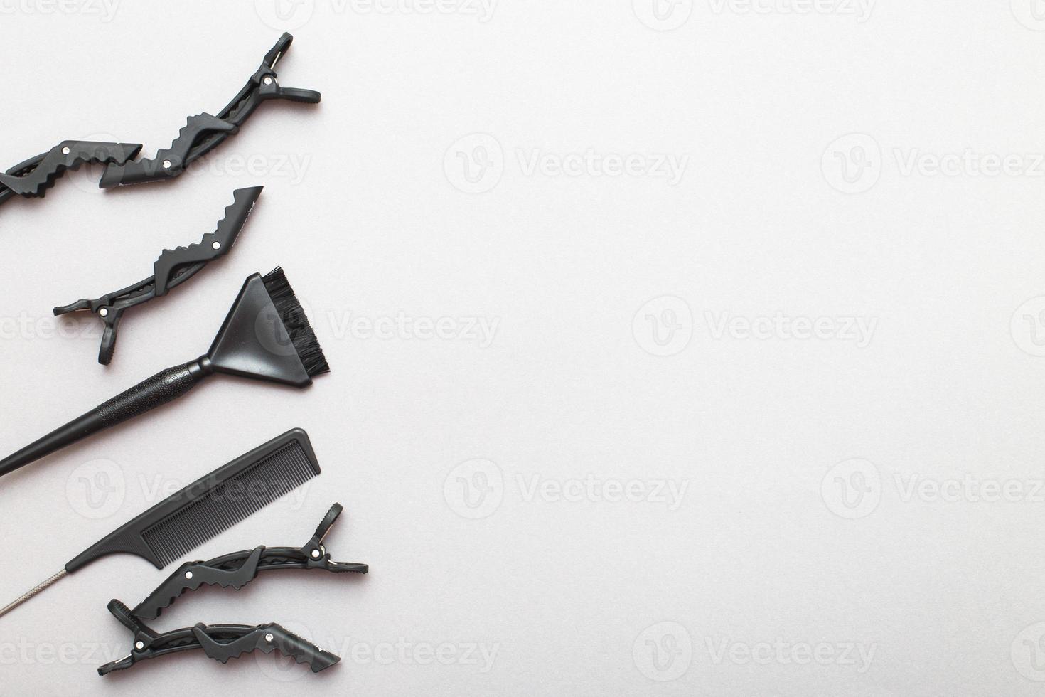 various hairdressing tools on a gray background. beauty salon concept photo