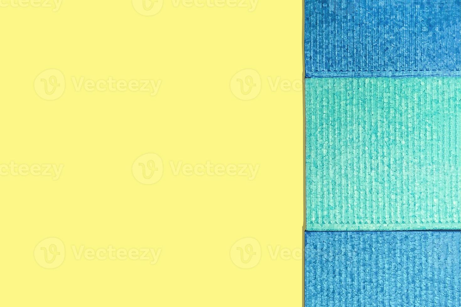 Texture blocks of polystyrene foam for sports on a yellow background. photo