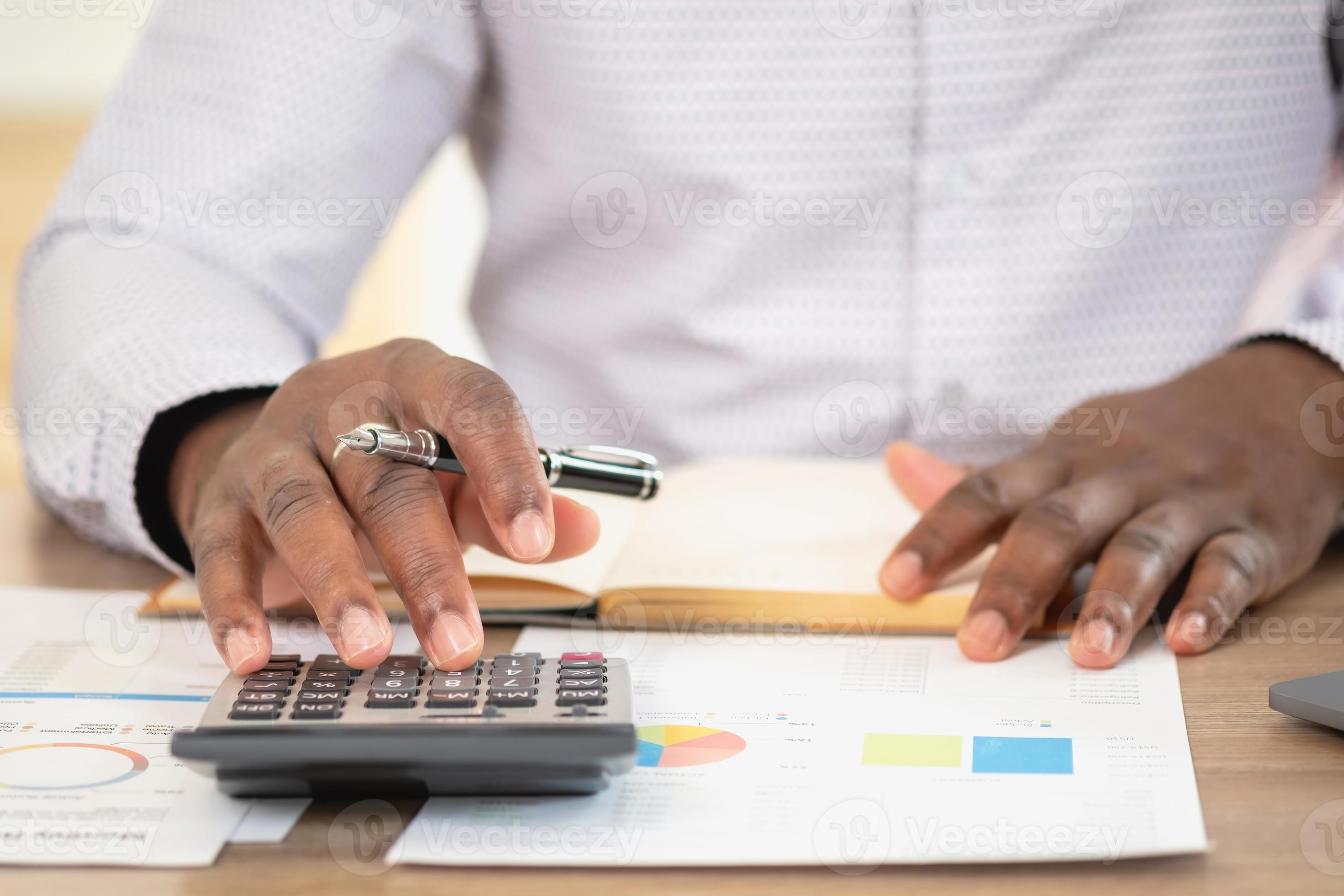 African black businessman sitting doing a financial report and studying African black businessman sitting doing a financial report and studying