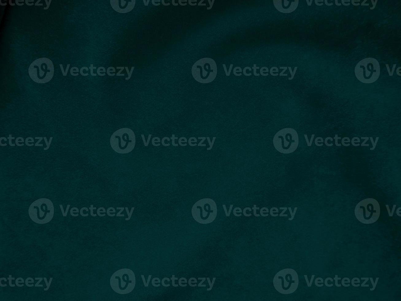 Dark green old velvet fabric texture used as background. Empty green fabric background of soft and smooth textile material. There is space for text.. photo