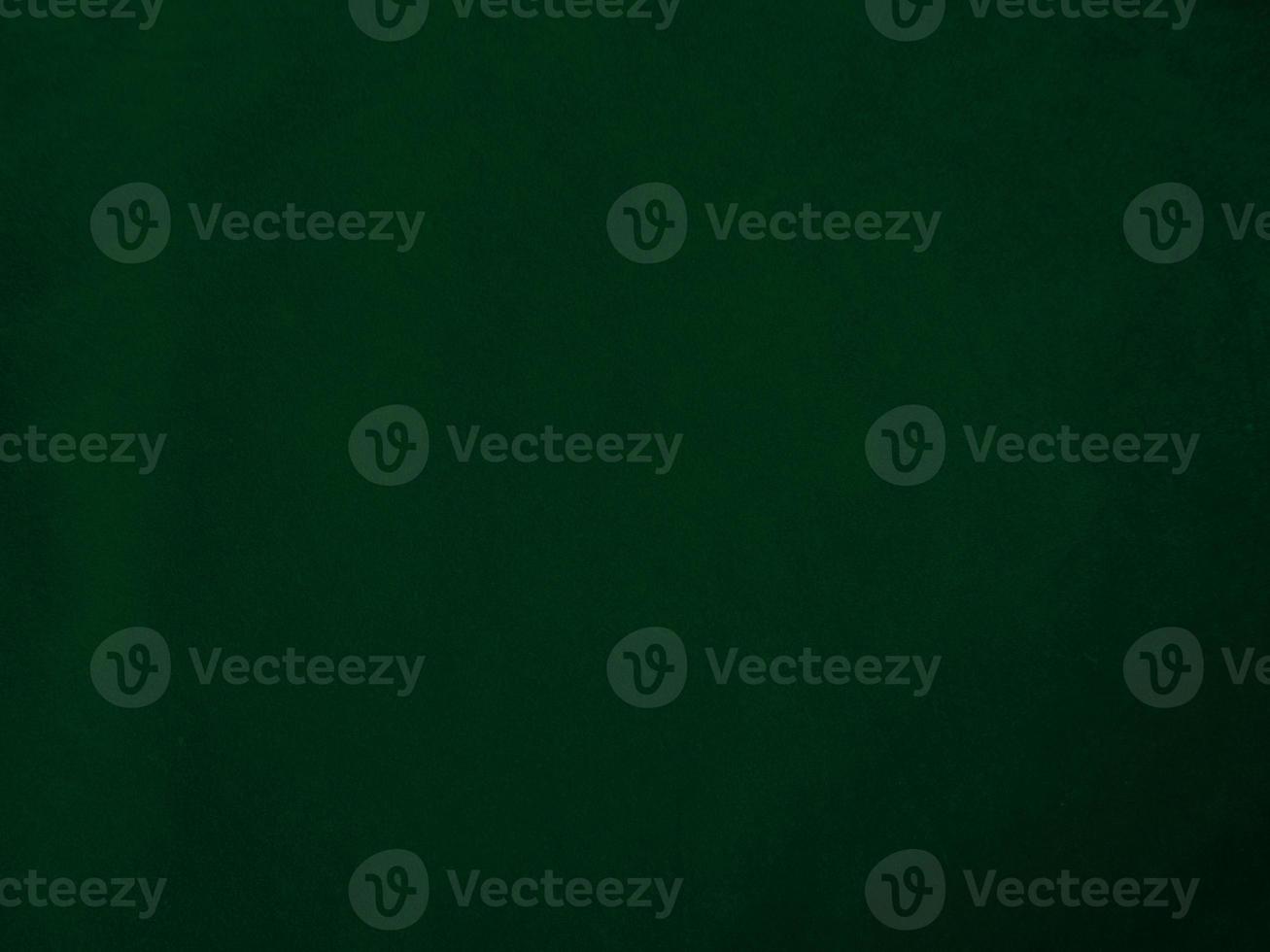 Dark green old velvet fabric texture used as background. Empty green fabric background of soft and smooth textile material. There is space for text.. photo
