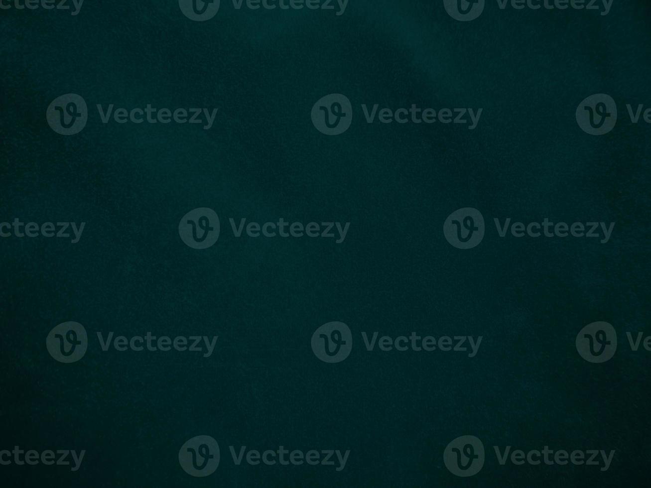 Dark green old velvet fabric texture used as background. Empty green fabric background of soft and smooth textile material. There is space for text.. photo